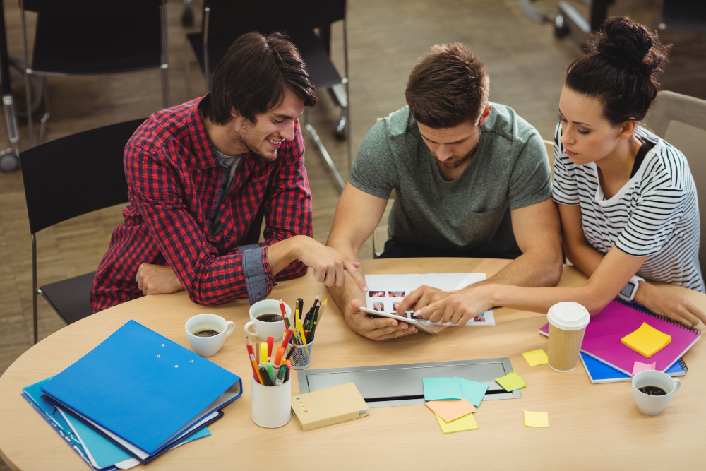 graphic-designers-interacting-their-desk